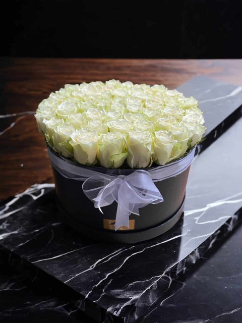 50 White roses in a black box